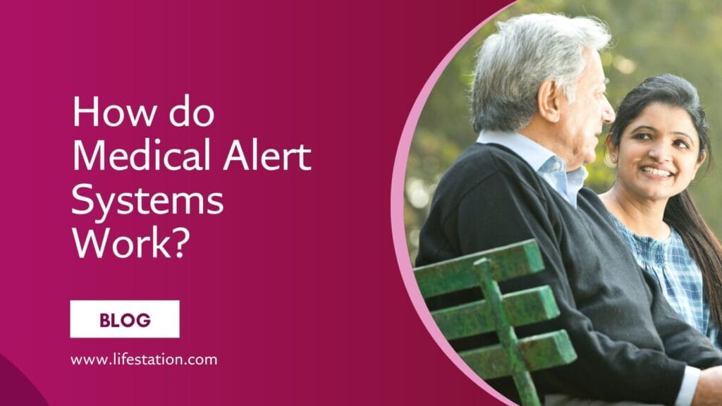 Elderly man sitting on a park bench with a younger woman, both smiling, as they discuss how medical alert systems work.